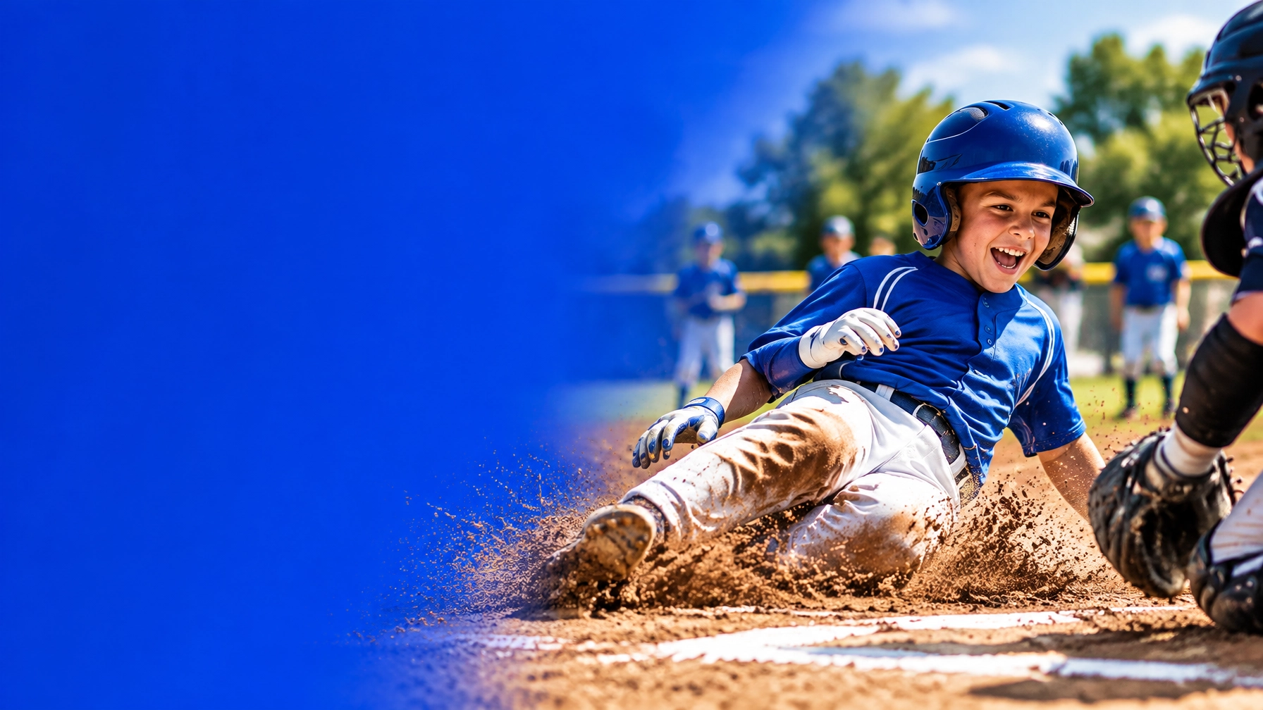 Young baseball player sliding into home plate